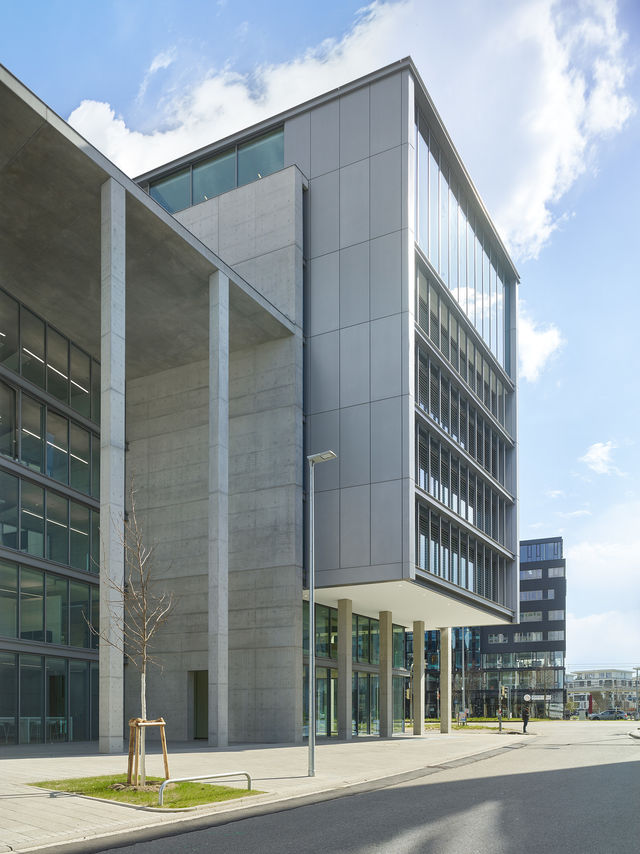 The top of the building is supported by round concrete supports.