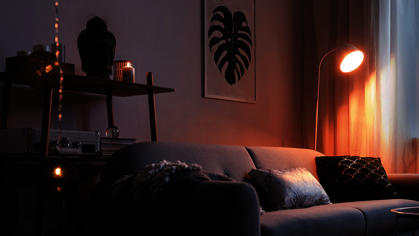 Gemütliches Wohnzimmer mit grauer Couch, Pflanzen und indirekter Beleuchtung