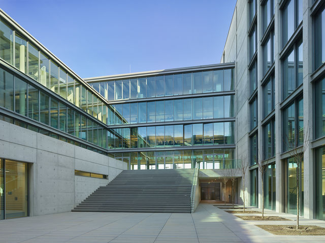 A wide concrete staircase leads to the first floor in the inner courtyard of the weisenburger building.