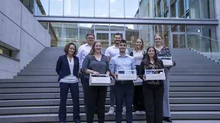 Group photo of the graduates of the dual study program at weisenburger