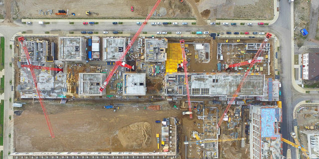 Rohbau Freiburg von oben Drohnenaufnahme einer großen weisenburger-Baustelle in Freiburg