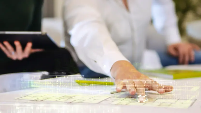 A man demonstrates something on an innovative floor plan