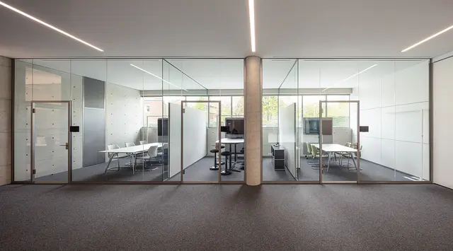 Modern meeting and conference rooms with glass walls on the first floor of weisenburger