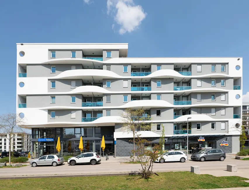 Residential and commercial building in Freiburg Apartment building with a bakery and a drugstore on the ground floor