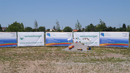 Quarter of diversity and weisenburger bau groundbreaking with toy excavators