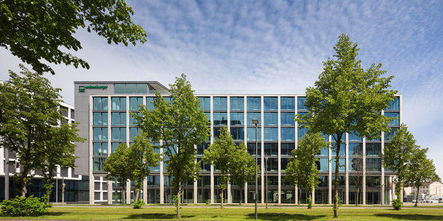 Frontal view of the south facade © HGEsch Frontal view of the south facade of the new weisenburger´s headquarter with green trees