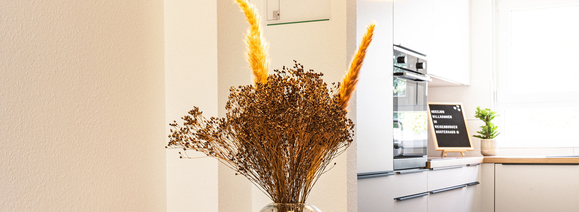 Decoration Vase of dried flowers on wooden table