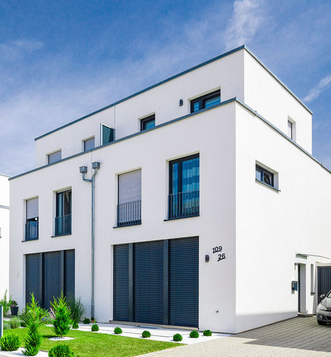 Chic new semi-detached houses with well-tended front gardens