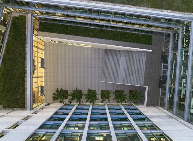 View of the inner courtyard of the weisenburger office building with green roofs and trees