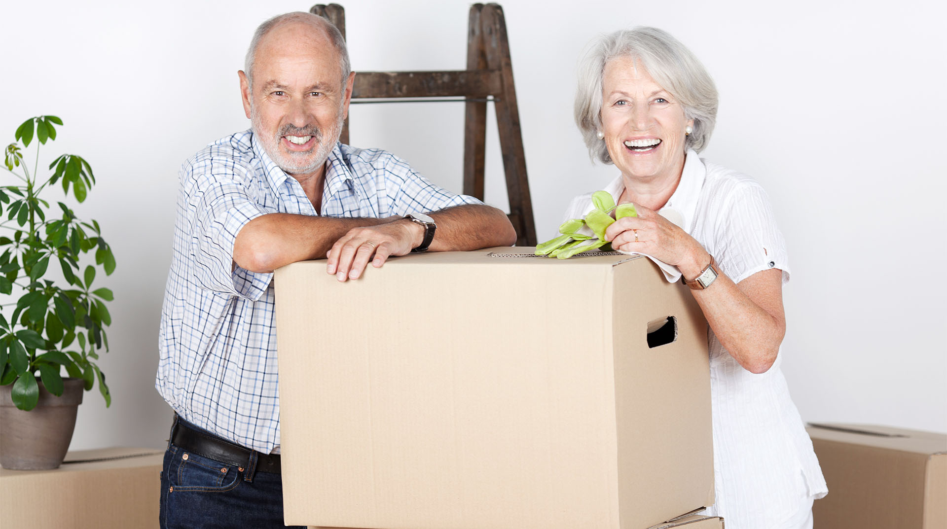 Happy senior couple move into a new weisenburger building